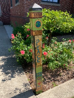 Library peace pole in the outdoor labyrinth